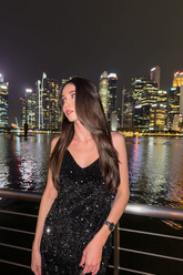 a lady in a black velvet sequin dress